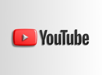 A prominent YouTube logo with a red play button icon on the left and the word 'YouTube' in bold black letters on the right, set against a light gray background.